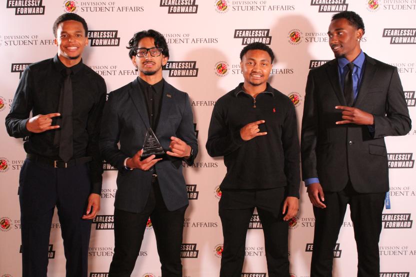 Members of Phi Beta Sigma Fraternity, Inc. with award