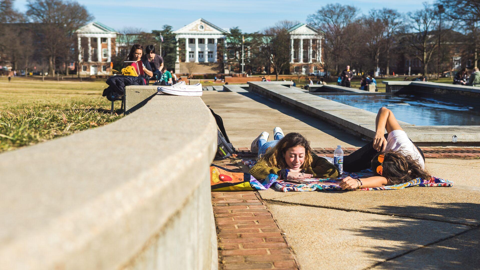 Students outdoors on the Mall on an unseasonably warm February day.