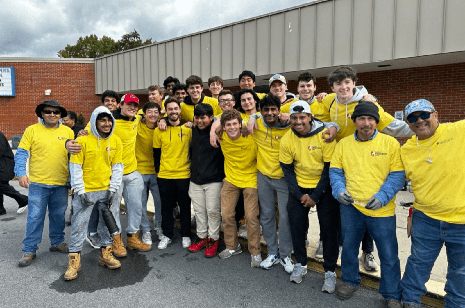 Sigma Phi Delta members volunteering