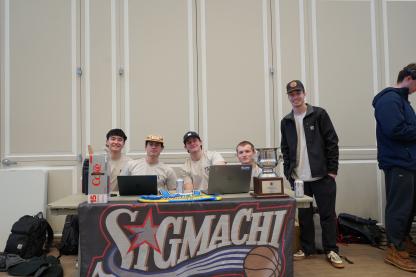 Four men sitting behind a table